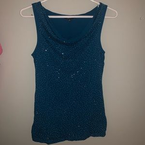 The limited blue tank top with silver beads on front